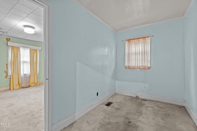 unfurnished room featuring light colored carpet and ornamental molding