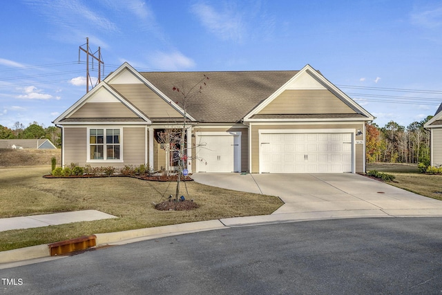 view of front of property featuring a garage, driveway, a front lawn, and roof with shingles