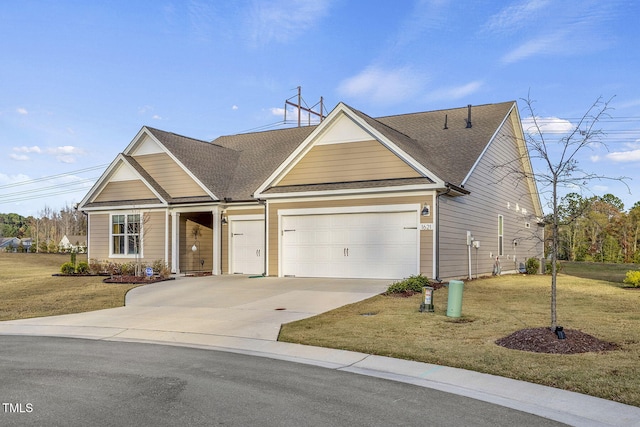 view of front of property with an attached garage, roof with shingles, concrete driveway, and a front yard