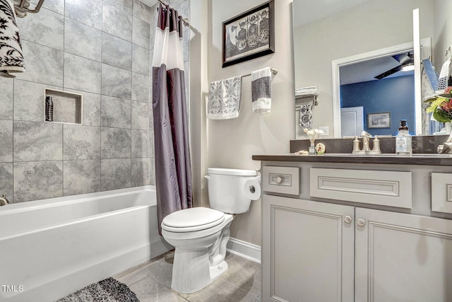 bathroom with toilet, baseboards, shower / bath combination with curtain, and vanity