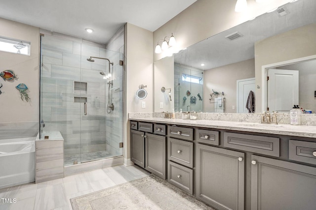 full bath featuring double vanity, visible vents, a sink, a shower stall, and a bath