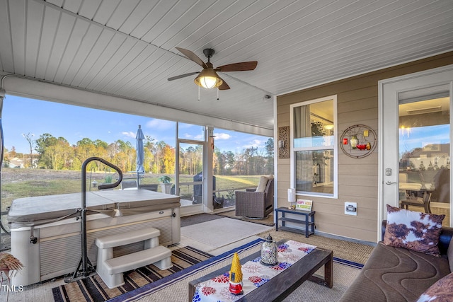 sunroom / solarium with ceiling fan and wooden ceiling