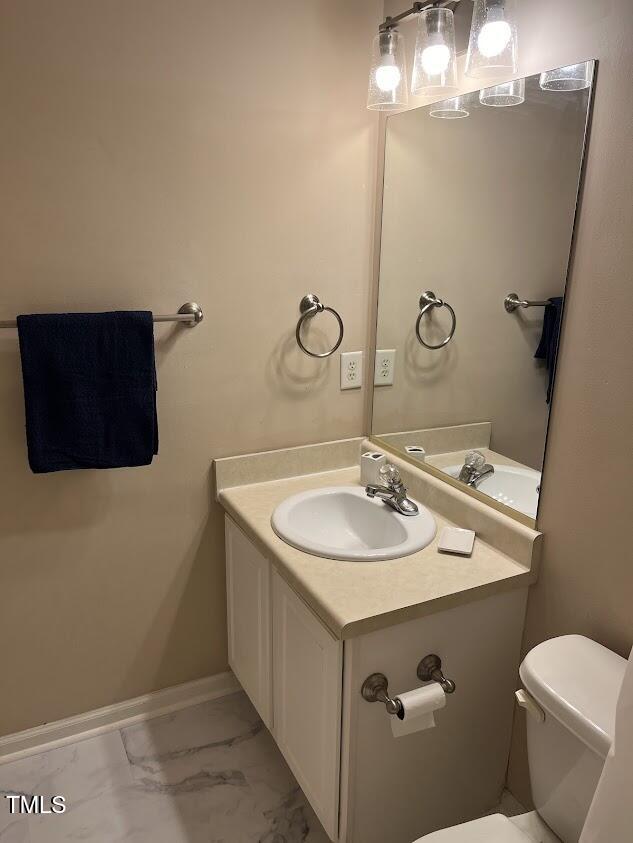 bathroom with vanity and toilet