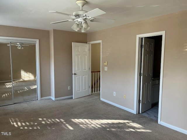 unfurnished bedroom featuring light colored carpet, a closet, and ceiling fan