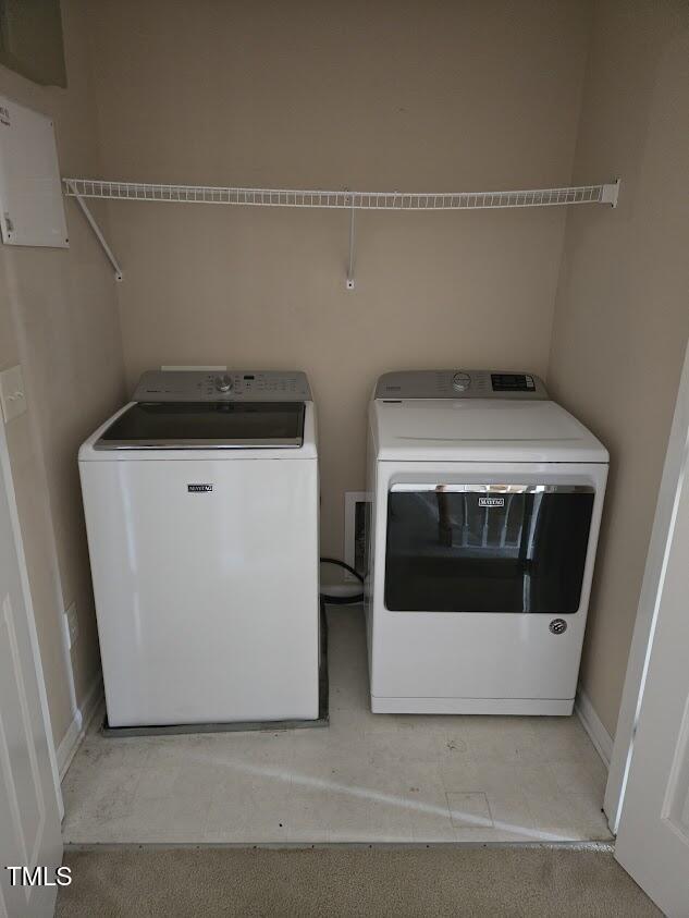 laundry room featuring washing machine and clothes dryer