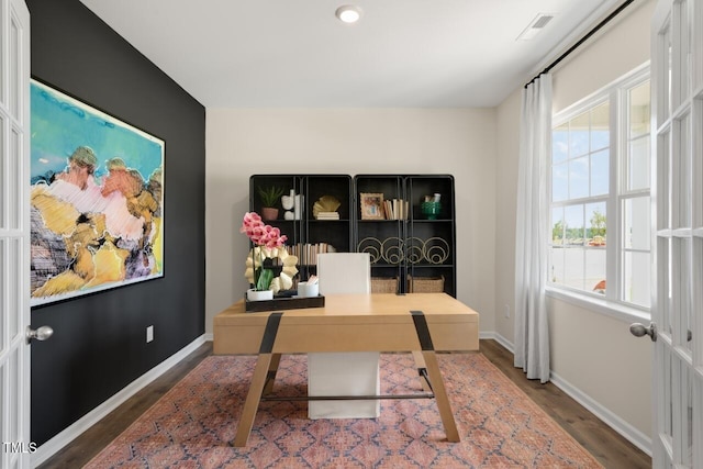 home office with wood finished floors and baseboards