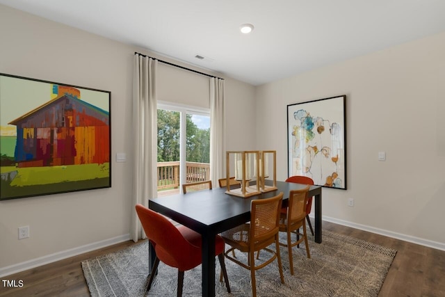 dining area with wood finished floors, baseboards, and recessed lighting