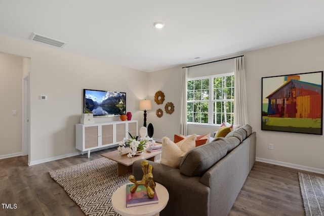living area featuring wood finished floors and baseboards