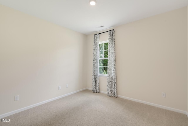 carpeted empty room with baseboards and recessed lighting