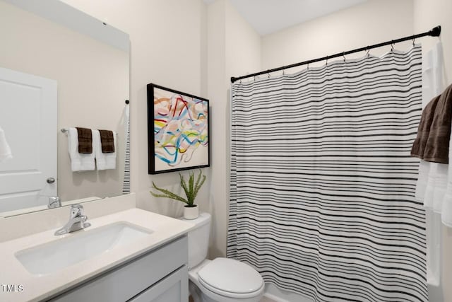 bathroom with vanity, toilet, and a shower with shower curtain