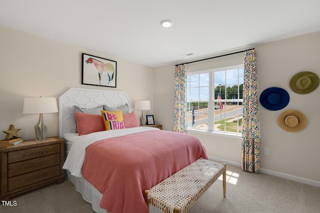 bedroom featuring baseboards and carpet flooring