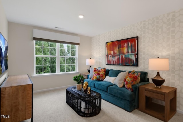living room with baseboards, carpet, and wallpapered walls