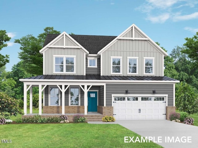 view of front facade with covered porch, a front yard, and a garage