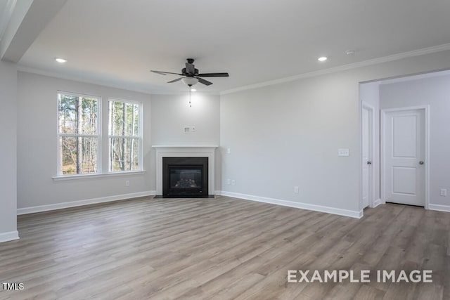 unfurnished living room with ornamental molding, ceiling fan, and light wood-type flooring