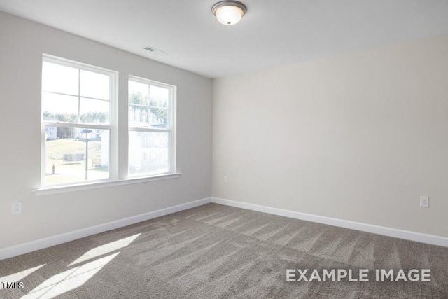 view of carpeted spare room