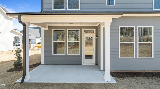 entrance to property featuring a patio area