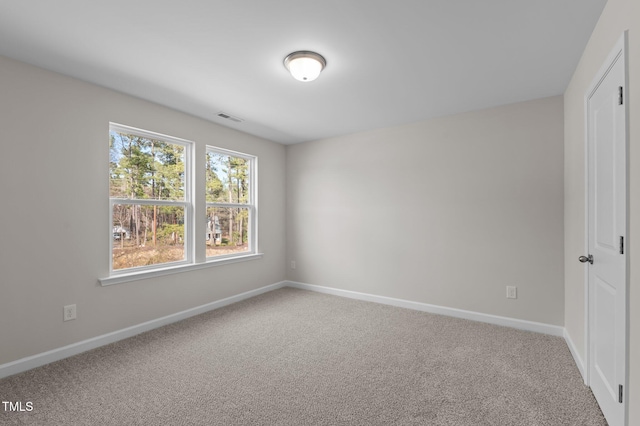 interior space with carpet, visible vents, and baseboards