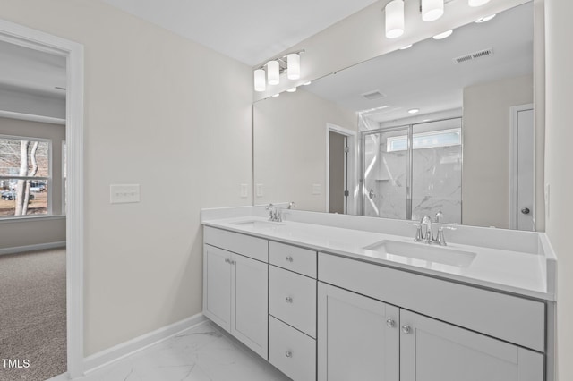 full bath with marble finish floor, visible vents, a sink, and baseboards