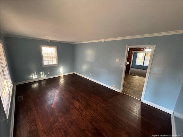 unfurnished room featuring wood-type flooring and ornamental molding