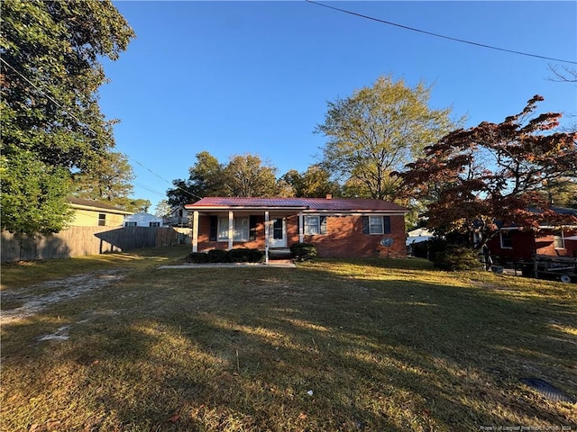 ranch-style home with a front yard and a porch