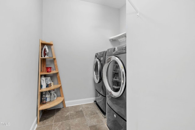 clothes washing area featuring washing machine and dryer