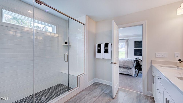 bathroom with vanity and a shower with shower door