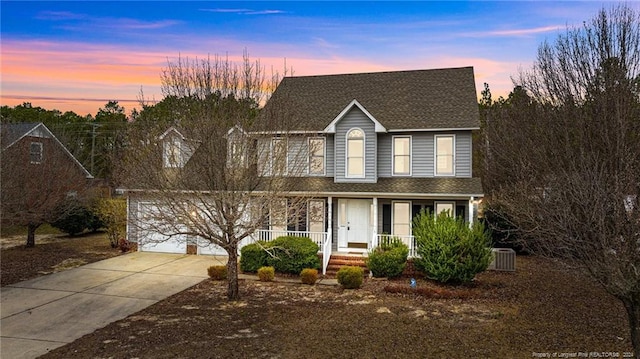 310 Interchange Dr, Fayetteville, NC 28311 - view of front facade with central AC unit and a porch