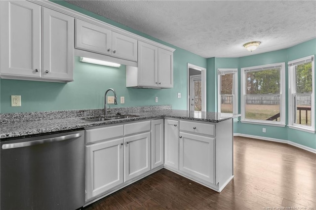 310 Interchange Dr, Fayetteville, NC 28311 - kitchen with white cabinets, dishwasher, dark hardwood / wood-style flooring, and sink