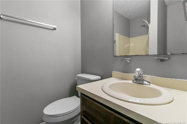 310 Interchange Dr, Fayetteville, NC 28311 - bathroom with vanity, a shower, a textured ceiling, and toilet