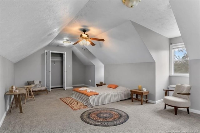 310 Interchange Dr, Fayetteville, NC 28311 - bedroom with ceiling fan, light colored carpet, lofted ceiling, and a textured ceiling