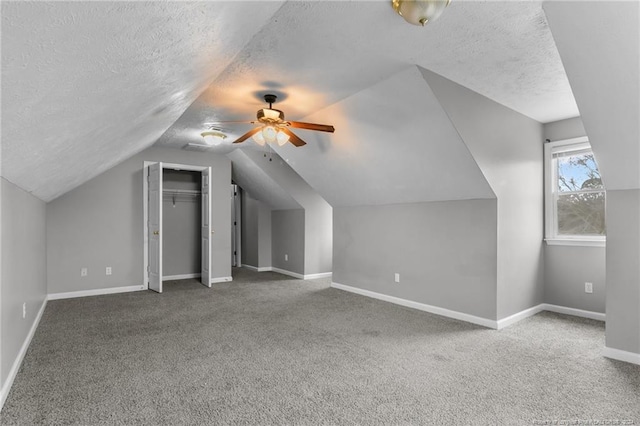 310 Interchange Dr, Fayetteville, NC 28311 - bonus room with lofted ceiling, ceiling fan, carpet floors, and a textured ceiling