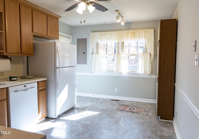 kitchen with ceiling fan, white appliances, a textured ceiling, and electric panel