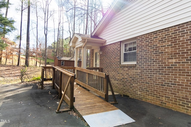 wooden terrace with a storage unit