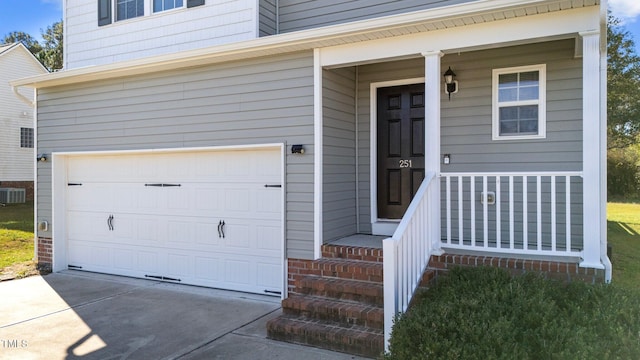 property entrance featuring central AC unit and a garage