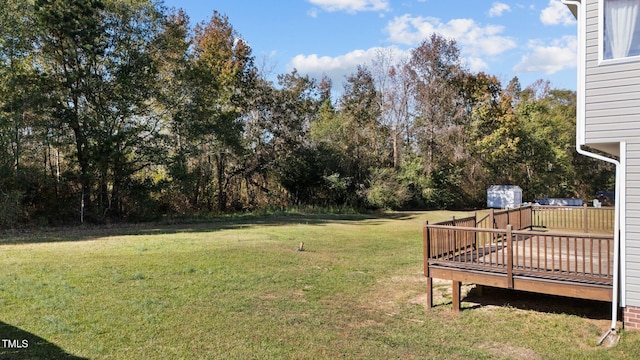 view of yard featuring a wooden deck