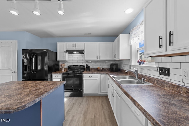 kitchen with backsplash, black appliances, sink, light hardwood / wood-style floors, and white cabinetry