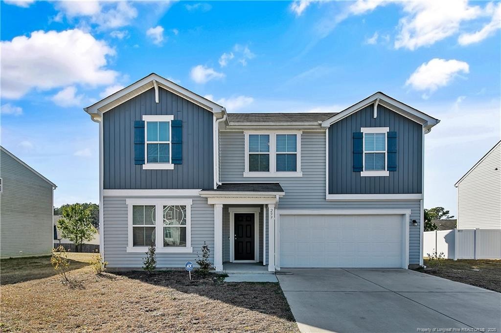 view of front of property with a garage