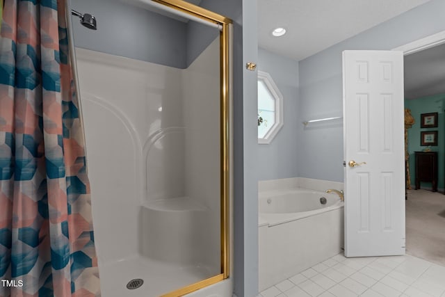 bathroom with tile patterned flooring and independent shower and bath