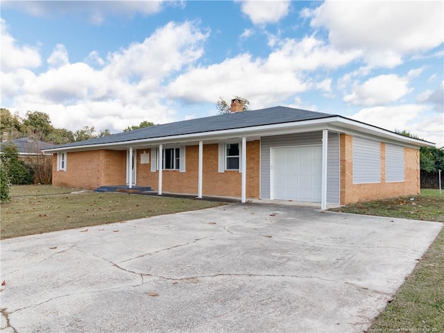 ranch-style house with a garage and a front lawn