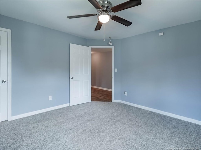 carpeted empty room with ceiling fan