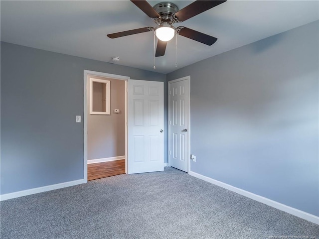 unfurnished bedroom with carpet flooring and ceiling fan