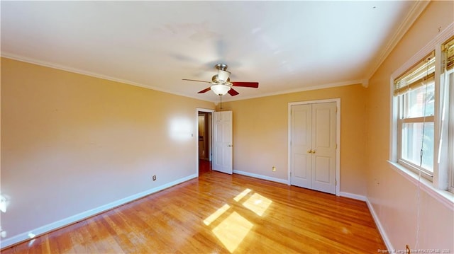 3327 Seven Mountain Dr, Fayetteville, NC 28306 - unfurnished bedroom with baseboards, ornamental molding, a ceiling fan, and light wood-type flooring