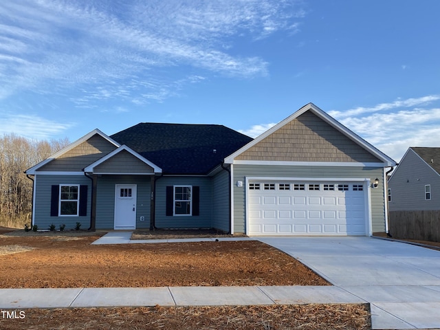 view of front facade featuring a garage and concrete driveway