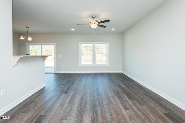 unfurnished room with baseboards, dark wood-style flooring, and recessed lighting