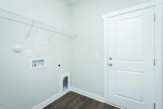 clothes washing area featuring dark wood-style flooring, hookup for a washing machine, electric dryer hookup, laundry area, and baseboards