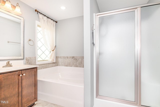 full bathroom featuring a garden tub, vanity, recessed lighting, and a shower stall