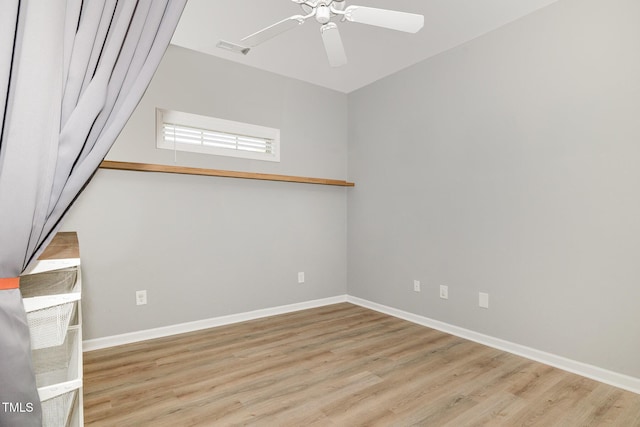 unfurnished room with visible vents, baseboards, wood finished floors, and ceiling fan