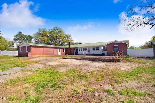 rear view of property featuring a patio