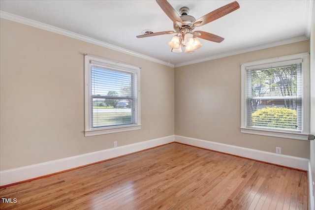 unfurnished room with ceiling fan, light wood-type flooring, and crown molding