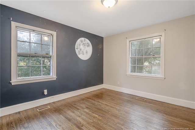 empty room featuring hardwood / wood-style floors